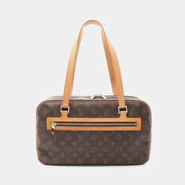 Louis Vuitton: Коричневая сумка 