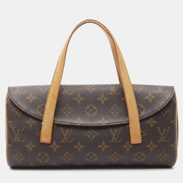 Louis Vuitton: Коричневая сумка 