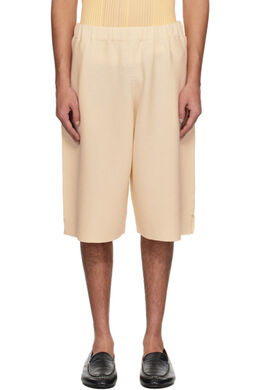 Homme Plissé Issey Miyake: Бежевые шорты 
