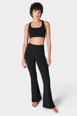 Sweaty Betty: Расклешённые брюки 