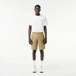 LACOSTE: Бежевые шорты 