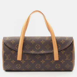 Louis Vuitton: Коричневая сумка 