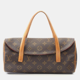 Louis Vuitton: Коричневая сумка 