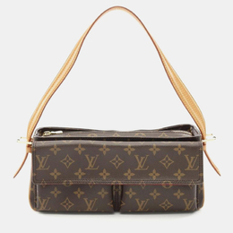 Louis Vuitton: Коричневая сумка 