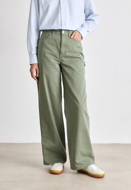 Tommy Jeans: Зелёные брюки 