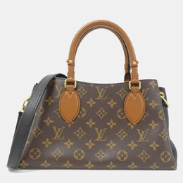 Louis Vuitton: Коричневая сумка 