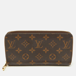Louis Vuitton: Коричневый кошелёк  Zippy