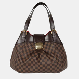 Louis Vuitton: Коричневая сумка 