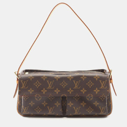 Louis Vuitton: Коричневая сумка 