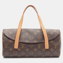 Louis Vuitton: Коричневая сумка 
